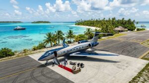 5 Most Exclusive Private Jet Expeditions Around the World 1 Horizontal view of a private jet parked at a remote luxury tropical destination.