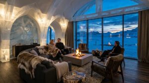  Inside a luxury frozen resort lounge showcasing detailed ice walls, a central fireplace, and premium cozy modern furniture.