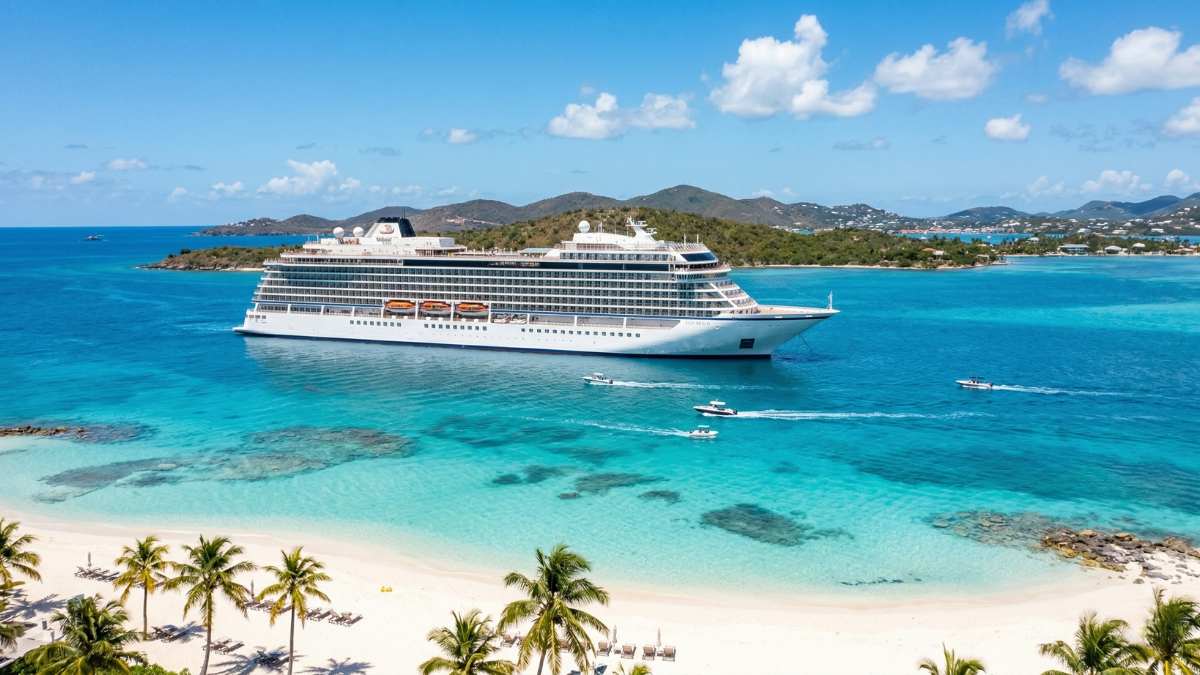 Multi-generational family enjoying the best luxury Caribbean cruises on a private deck.